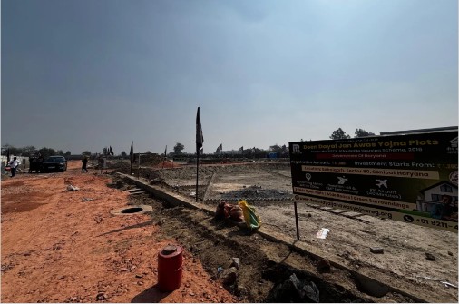 Site road with project signboard